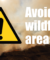 An image of a moorland wildfire with text asking people to avoid wildfire areas